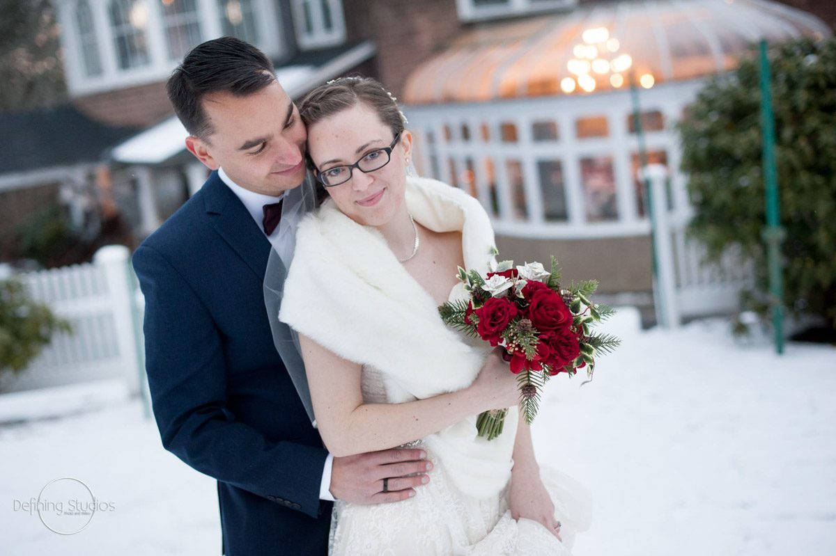 Winter Wedding bride-groom-outside-infront-of-conservatory-for-winter-wedding